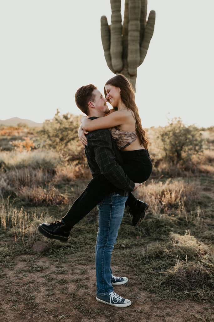 Fun couple session with a saguaro cactus in the background